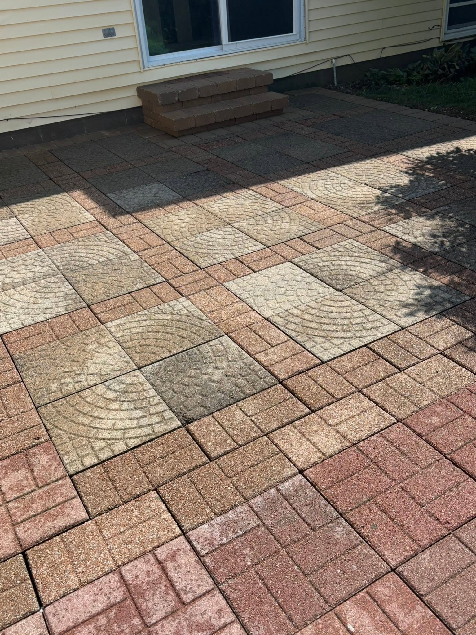 The same patterned paver patio after cleaning